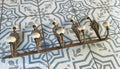 Antique French Cast Iron Wall Coat Rack | Belle Époque Porcelain Tipped Hooks | Acanthus Shell Motif
