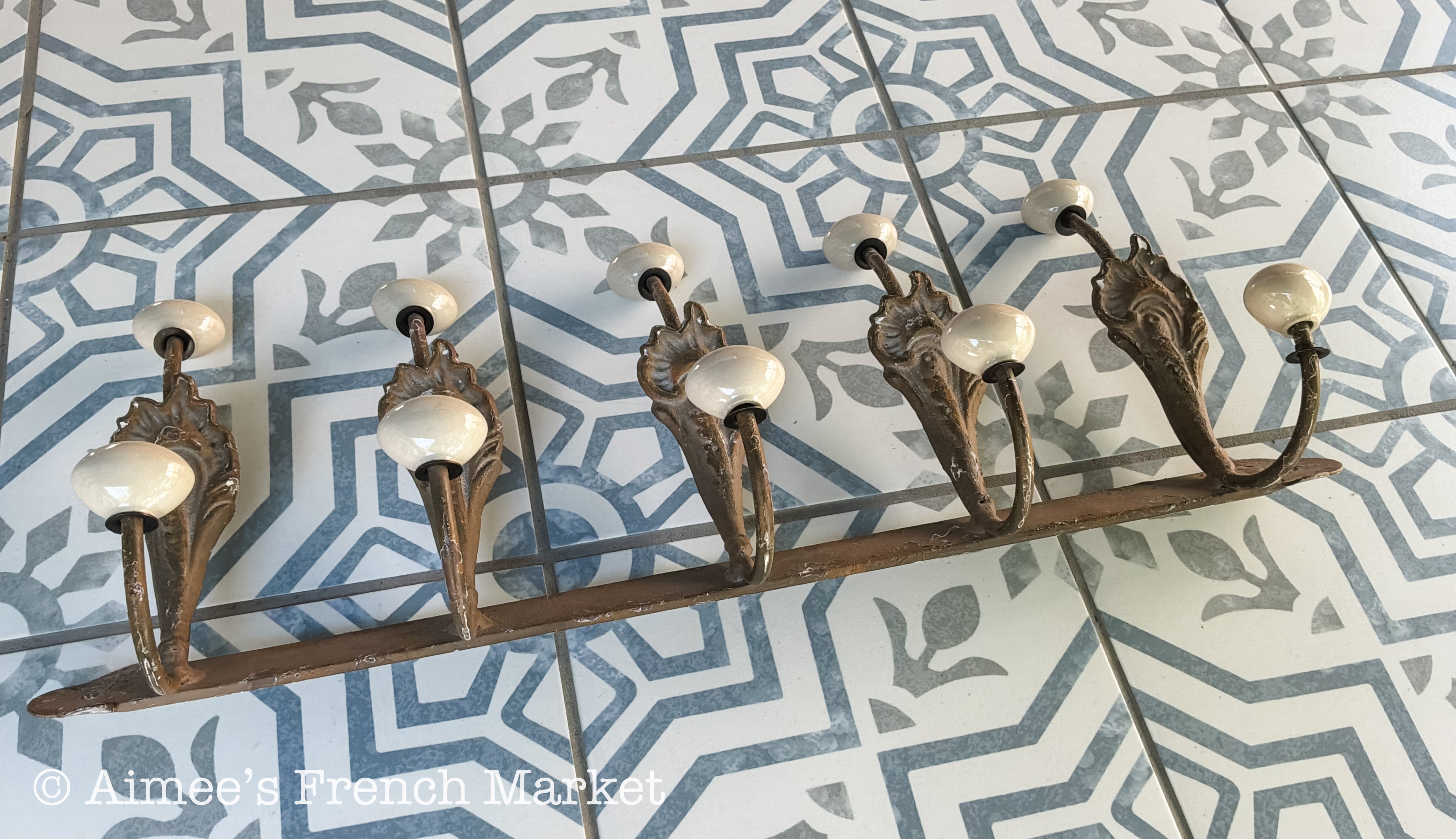 Antique French Cast Iron Wall Coat Rack | Belle Époque Porcelain Tipped Hooks | Acanthus Shell Motif