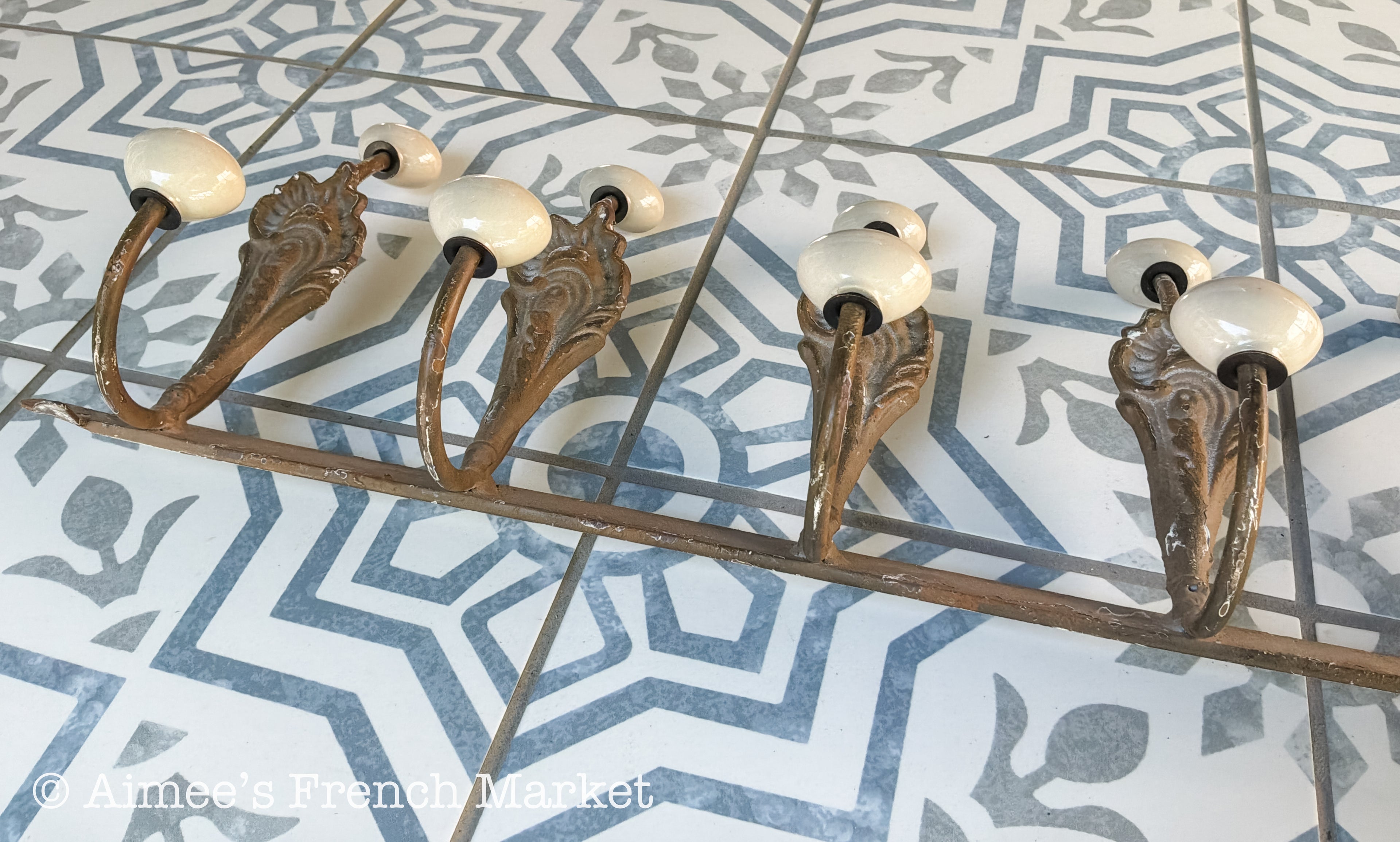 Antique French Cast Iron Wall Coat Rack | Belle Époque Porcelain Tipped Hooks | Acanthus Shell Motif