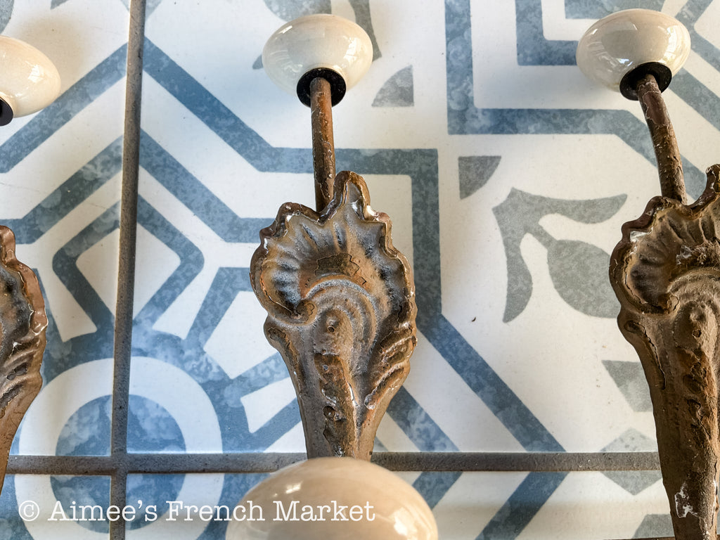 Antique French Cast Iron Wall Coat Rack | Belle Époque Porcelain Tipped Hooks | Acanthus Shell Motif